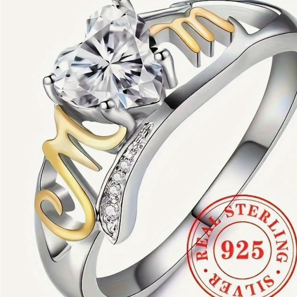 Elegant Silver and Gold Ring with Heart-Shaped Gemstone